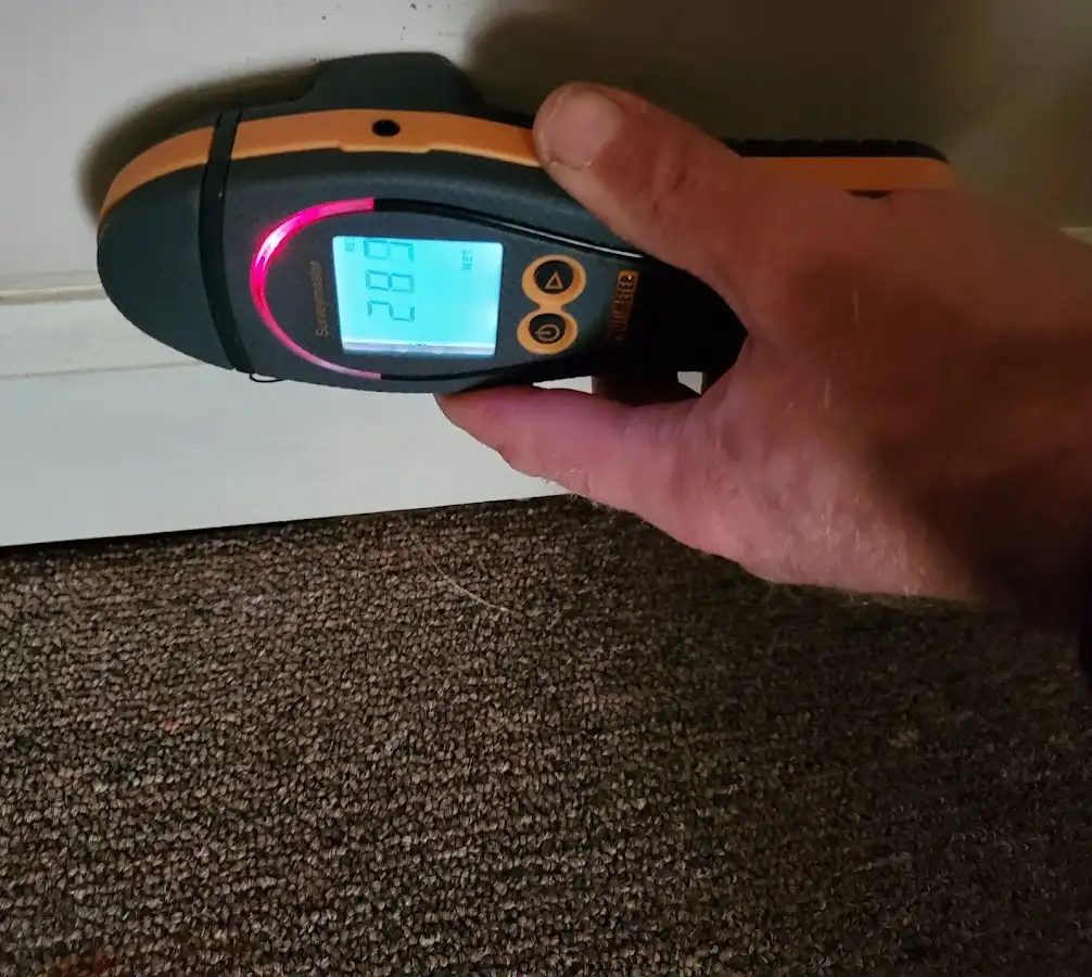 Moisture detection at baseboard during Storm Damage Restoration in Crest Hill